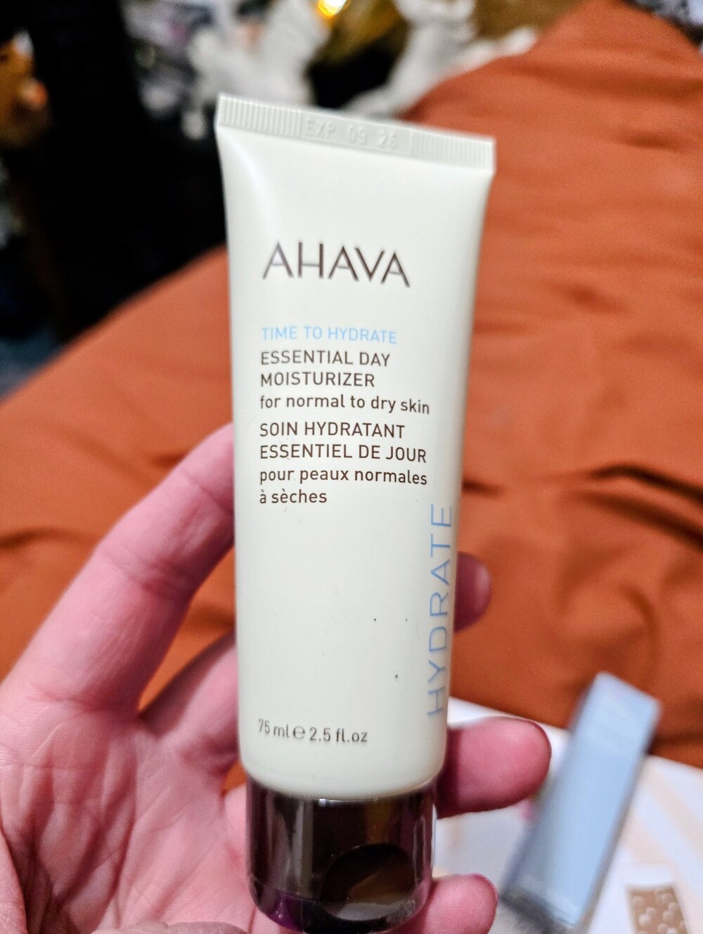 AHAVA Cream Tube Moisturizer with Blue Accents